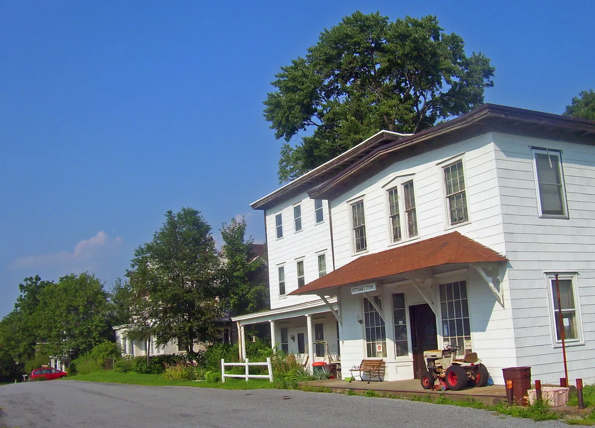 Frame building at a road bend in Mountainville, New York