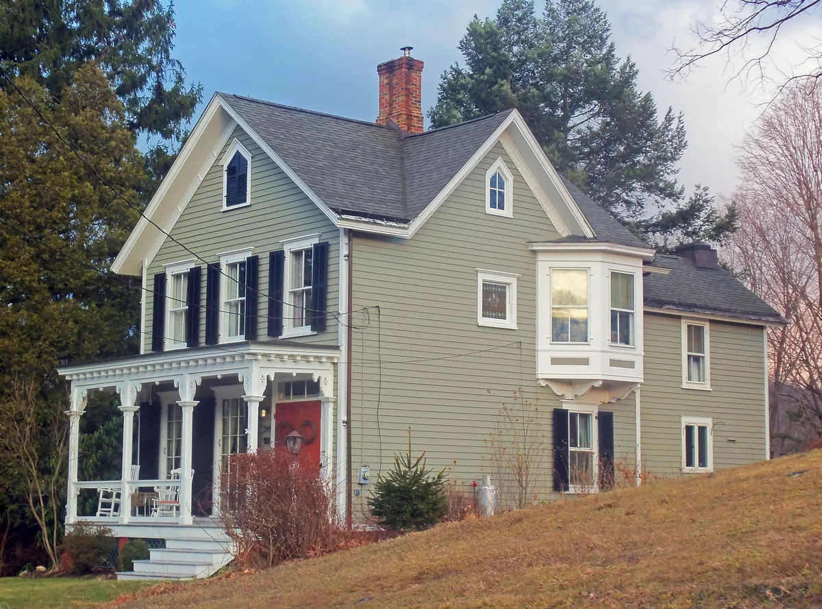 Frame house with a brick chimney on Main Street in Nelsonville, New York