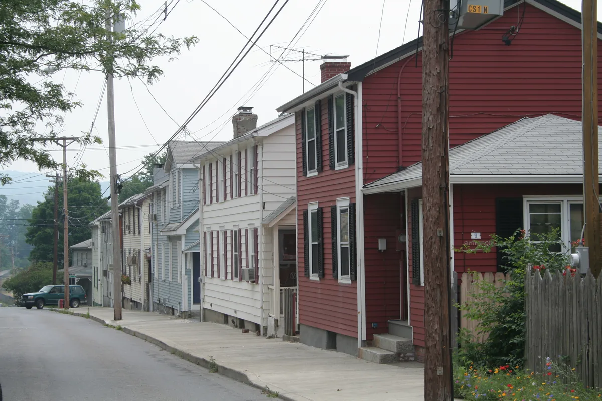 Row of frame houses on a sloping street in Cold Spring, New York